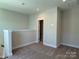 Loft bedroom with access to bathroom and carpet flooring at 1421 Collier Walk Aly # Csw0209, Charlotte, NC 28205