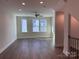 Spacious bedroom with hardwood floors and large windows at 1421 Collier Walk Aly # Csw0209, Charlotte, NC 28205