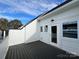 Private rooftop deck with gray composite decking and white railings at 1421 Collier Walk Aly # Csw0209, Charlotte, NC 28205