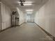 Unfinished garage with concrete floor and ample space at 1421 Collier Walk Aly # Csw0209, Charlotte, NC 28205