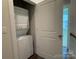 Convenient laundry closet with stackable washer and dryer at 1421 Collier Walk Aly # Csw0209, Charlotte, NC 28205