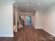 Bright living room with hardwood floors and open concept floor plan at 1421 Collier Walk Aly # Csw0209, Charlotte, NC 28205