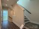 Modern staircase with dark wood steps and neutral walls at 1421 Collier Walk Aly # Csw0209, Charlotte, NC 28205