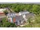 Aerial view of modern townhomes surrounded by lush greenery with a cityscape view in the background at 1423 Collier Walk Aly # Csw0210, Charlotte, NC 28205