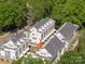 Aerial view of well-maintained townhomes surrounded by green trees with manicured lawns and modern architecture at 1423 Collier Walk Aly # Csw0210, Charlotte, NC 28205