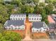 Aerial view of a community of townhomes, emphasizing the subject property's location at 1423 Collier Walk Aly # Csw0210, Charlotte, NC 28205