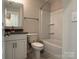 Clean bathroom with tub shower combo, vanity, and toilet at 1423 Collier Walk Aly # Csw0210, Charlotte, NC 28205