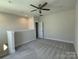 Versatile bedroom featuring a ceiling fan and neutral color palette at 1423 Collier Walk Aly # Csw0210, Charlotte, NC 28205