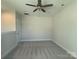 Bright bedroom with ceiling fan and plush carpeting at 1423 Collier Walk Aly # Csw0210, Charlotte, NC 28205