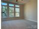 Spacious bedroom with multiple windows and plush carpeting at 1423 Collier Walk Aly # Csw0210, Charlotte, NC 28205