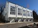 Townhome building showcasing multiple units, garages, and a clean design at 1423 Collier Walk Aly # Csw0210, Charlotte, NC 28205