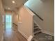 Light hallway with stairs and access to multiple rooms at 1423 Collier Walk Aly # Csw0210, Charlotte, NC 28205