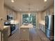 Modern kitchen with stainless steel appliances and an island at 1423 Collier Walk Aly # Csw0210, Charlotte, NC 28205