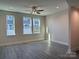 Bright living room with hardwood floors and large windows at 1423 Collier Walk Aly # Csw0210, Charlotte, NC 28205