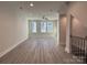 Bright living room featuring hardwood floors and large windows at 1423 Collier Walk Aly # Csw0210, Charlotte, NC 28205