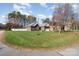 Brick home nestled amongst other homes with green lawns at 1009 Amber Ct, China Grove, NC 28023