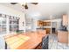 Kitchen dining area with wood table and chairs, looking toward the kitchen at 1009 Amber Ct, China Grove, NC 28023