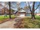 Brick home with driveway and autumn leaves at 1009 Amber Ct, China Grove, NC 28023