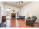 Living room with hardwood floors, fireplace and large windows at 1009 Amber Ct, China Grove, NC 28023