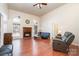 Living room with hardwood floors, fireplace and large windows at 1009 Amber Ct, China Grove, NC 28023