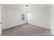 Bright bedroom with carpeted floor and window at 1021 Freeman View Dr # 154P, Albemarle, NC 28001