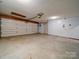 Spacious garage featuring epoxy flooring and a garage door opener at 117 Eagle Ct, Mooresville, NC 28117