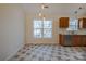 Cozy kitchen area featuring tile flooring, granite counters, wood cabinets, stainless steel appliances, and a window view at 117 Eagle Ct, Mooresville, NC 28117