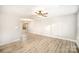 Open-concept living space with modern vinyl floors, neutral paint, and plenty of natural light at 1681 Evans Dr, Lancaster, SC 29720