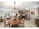 Staged living room and kitchen with stainless steel appliances, modern flooring and a bright interior at 1681 Evans Dr, Lancaster, SC 29720