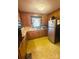 Galley kitchen with wood cabinets and yellow flooring at 1895 Forest Lake Dr, Rock Hill, SC 29732