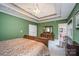 Main bedroom with green walls, walk-in closet, and ensuite bathroom access at 2111 Priory Ct, Charlotte, NC 28262