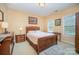 Spacious bedroom with wood furniture and ample natural light at 2111 Priory Ct, Charlotte, NC 28262