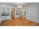 Bright dining room with hardwood floors and wainscoting at 2111 Priory Ct, Charlotte, NC 28262