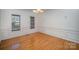 Bright dining room with hardwood floors and wainscoting at 2111 Priory Ct, Charlotte, NC 28262