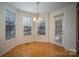 Charming dining area with hardwood floors and bay window at 2111 Priory Ct, Charlotte, NC 28262