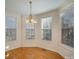 Bright dining room featuring hardwood floors and large windows at 2111 Priory Ct, Charlotte, NC 28262