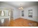 Bright dining room with hardwood floors and wainscoting at 2111 Priory Ct, Charlotte, NC 28262