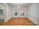 Bright dining room with hardwood floors and wainscoting at 2111 Priory Ct, Charlotte, NC 28262