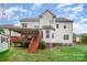 Two-story house with deck and landscaped yard at 2111 Priory Ct, Charlotte, NC 28262