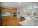 Large kitchen with island, stainless steel appliances and hardwood floors at 2111 Priory Ct, Charlotte, NC 28262