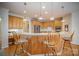 Kitchen island with seating and hardwood floors at 2111 Priory Ct, Charlotte, NC 28262