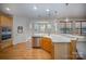 Large kitchen with island, stainless steel appliances and hardwood floors at 2111 Priory Ct, Charlotte, NC 28262