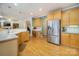 Kitchen boasts stainless steel appliances and ample cabinetry at 2111 Priory Ct, Charlotte, NC 28262