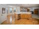 Open kitchen with an island, hardwood floors and a view of Gathering room at 2111 Priory Ct, Charlotte, NC 28262