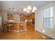 Bright kitchen with an island and hardwood floors at 2111 Priory Ct, Charlotte, NC 28262