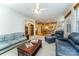 Spacious living room featuring leather furniture and a view into the kitchen at 2111 Priory Ct, Charlotte, NC 28262