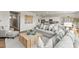 Open living area with light gray sofas, a large coffee table, and hardwood floors at 322 Bezelle Ave, York, SC 29745