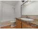 Clean bathroom with a single vanity and shower/tub combo at 1176 Peppertree Dr, Mount Holly, NC 28120