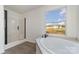 Bathroom with a large soaking tub and walk-in shower at 1176 Peppertree Dr, Mount Holly, NC 28120