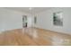 Bright bedroom with hardwood floors and access to bathroom at 1176 Peppertree Dr, Mount Holly, NC 28120